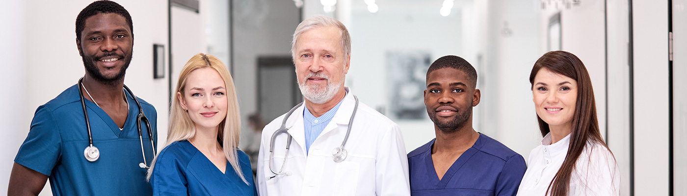 Diverse group of providers smiling together